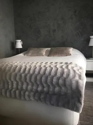 a bedroom with a bed with white sheets and two lamps at Elegant F2 with all comforts in center of Cannes in Cannes