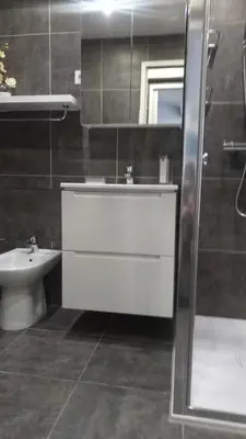 a bathroom with a sink and a toilet and a mirror at Elegant F2 with all comforts in center of Cannes in Cannes