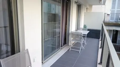 a balcony with two chairs and a table on it at Elegant F2 with all comforts in center of Cannes in Cannes