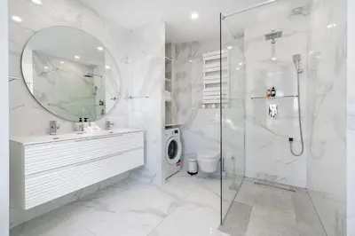 a bathroom with a shower and a sink and a mirror at Prestige Cannes Alexandre III Terrace 2bdr by B'Your Home in Cannes