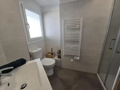 a bathroom with a toilet and a sink and a shower at Superbe Appartement Familial in Cannes