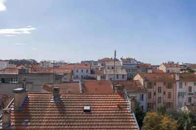 a view of a city with red tile roofs at Diplomate - 2 chambres, 15mn du Palais, charmant, balcon, clim in Cannes
