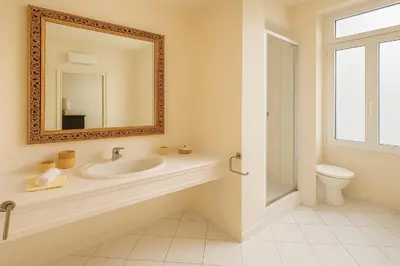 a bathroom with a sink and a mirror and a toilet at Studio chic à 200 m du Palais des Festivals, au cœur du shopping Cannois in Cannes