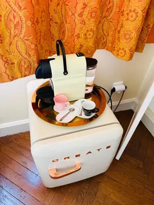 a coffee maker on a table with cups on it at Studio chic à 200 m du Palais des Festivals, au cœur du shopping Cannois in Cannes