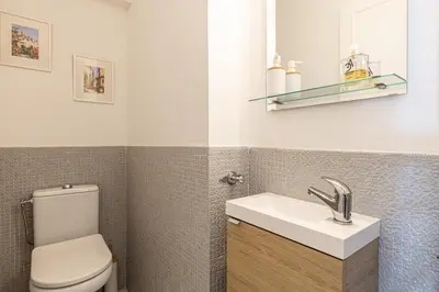 a bathroom with a toilet and a sink at PALM BEACH, sea view apartment, 100m from beaches in Cannes