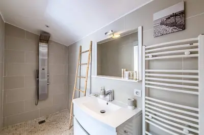 a bathroom with a sink and a mirror at Diane By Terrys Homes in Cannes
