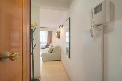 a hallway with a door and a couch in a room at Palace - Ultra center - 2 min sea - VCA in Cannes