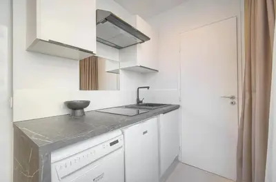 a kitchen with a sink and a counter top at Palace - Ultra center - 2 min sea - VCA in Cannes