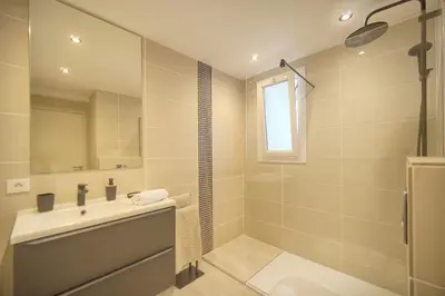a bathroom with a sink and a shower at Palace - Ultra center - 2 min sea - VCA in Cannes