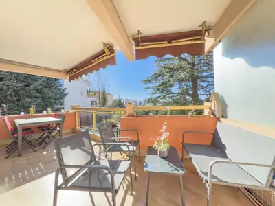 a patio with chairs and a table with a view at Le Cozy by Winsome Destination in Cannes