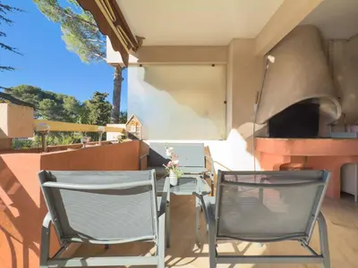 two chairs and a table on a balcony at Le Cozy by Winsome Destination in Cannes