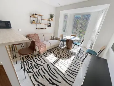 a living room with a couch and a table at Lovely 1 bedroom rue Pasteur near the Croisette 246 in Cannes