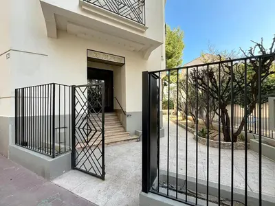 a bedroom with a white bed and a window at Lovely 1 bedroom rue Pasteur near the Croisette 246 in Cannes