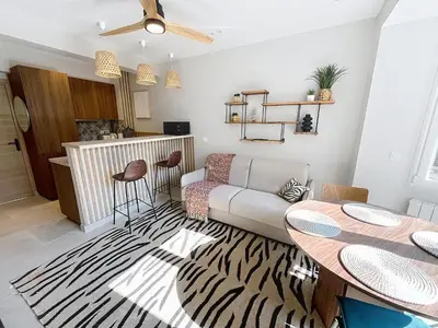 a living room with a table and a couch at Lovely 1 bedroom rue Pasteur near the Croisette 246 in Cannes