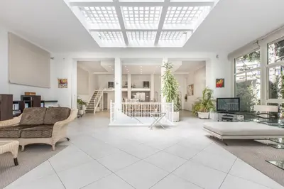 a bedroom with a bed and a mirror on the wall at Heart of Cannes Luxury Stay - Steps from Beach & Palais in Cannes
