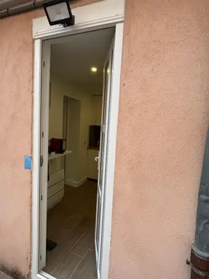 a door leading into a room with a kitchen at Palais des festivals Studio meublé in Cannes
