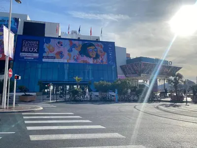an empty street in front of a large building at Palais des festivals Studio meublé in Cannes