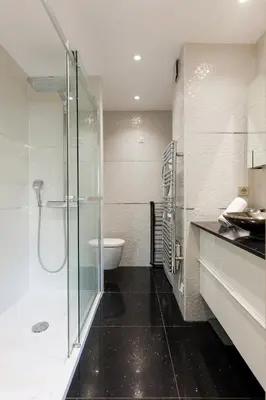 a bathroom with a glass shower and a toilet at Immogroom Luxury 1 bedAppartment AC Terrace in Cannes