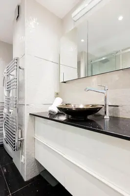 a bathroom with a sink and a mirror at Immogroom Luxury 1 bedAppartment AC Terrace in Cannes