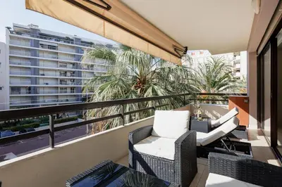 a balcony with chairs and a view of a city at Immogroom Luxury 1 bedAppartment AC Terrace in Cannes