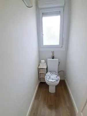 a small bathroom with a toilet and a window at 4 - Person Apartment with Sea View terrace in Cannes