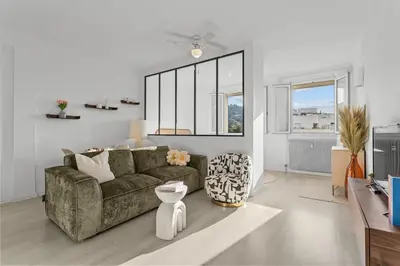 a living room with a couch and a table at Appartement à Cannes in Cannes