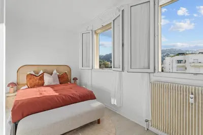 a bedroom with a bed and a window at Appartement à Cannes in Cannes