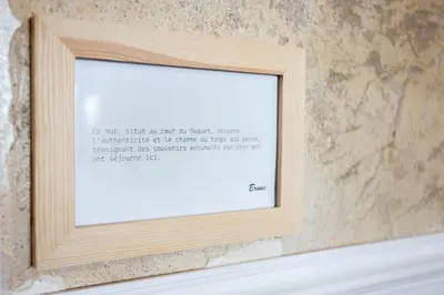 a picture frame on a wall in a bathroom at Charme du Suquet - 12mn du Palais&Plage, cosy, neuf in Cannes