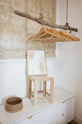 a wooden chair sitting on top of a dresser at Charme du Suquet - 12mn du Palais&Plage, cosy, neuf in Cannes