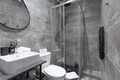 a bathroom with a shower and a toilet and a sink at Charme du Suquet - 12mn du Palais&Plage, cosy, neuf in Cannes