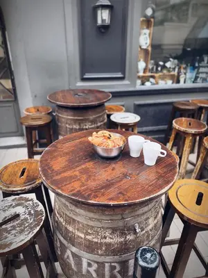 a table with bowls of food on top of a barrel at Verginia in Cannes