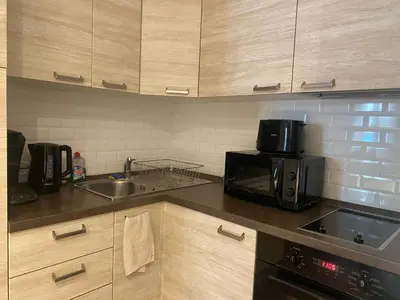 a kitchen with a microwave and a sink at Verginia in Cannes