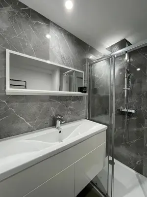 a bathroom with a tub and a shower and a sink at Beautiful Studio in Cannes, near beach and Croisette in Cannes