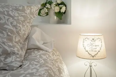 a white bedroom with a bed with two pillows at Sublime Appartement 5 Mins à Pied Du Palais Des Festivals by Halldis in Cannes