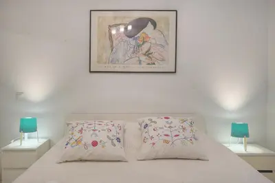 a bed with two pillows and a picture on the wall at Plaisant 2 Pieces TERRASSE, Clémenceau A1B263 in Cannes