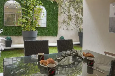 a glass table with croissants and bread on it at Plaisant 2 Pieces TERRASSE, Clémenceau A1B263 in Cannes