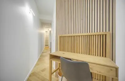 a wooden desk and a chair in a room at Charmant 2 pièces -square MISTRAL -proche Plages DU MIDI A1B266 in Cannes