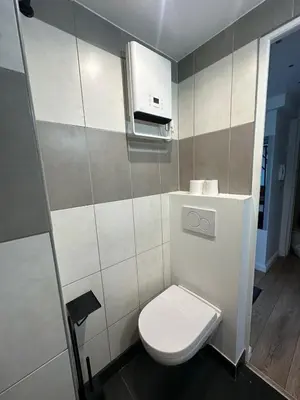 a small bathroom with a toilet and a sink at Studio cosy, 8 min à pied du Palais et de la Plage in Cannes