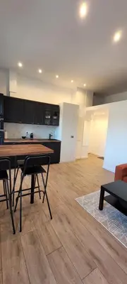 a kitchen with a table and chairs in a room at Studio cosy, 8 min à pied du Palais et de la Plage in Cannes