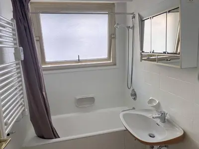 a white bathroom with a sink and a shower at Cannes proche Croisette - Studio in Cannes