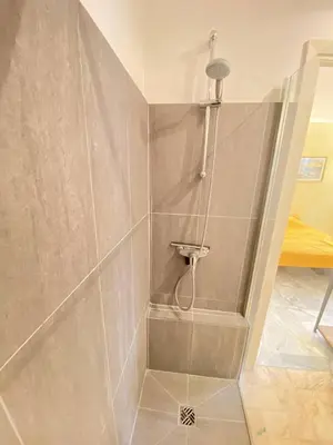 a shower stall in a bathroom with a shower at Cannes proche Croisette - Studio in Cannes