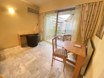 a room with a table and chairs and a window at Cannes proche Croisette - Studio in Cannes