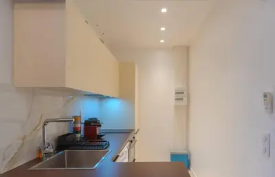 a kitchen with a sink and a counter top at Le Lac Studio Moderne Proche Suquet - climatisation Wifi - LIMESTAY in Cannes