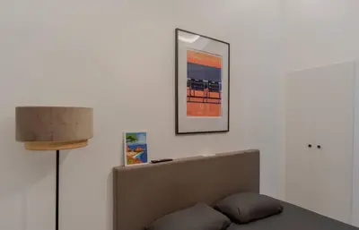 a living room with a couch and a picture on the wall at Le Lac Studio Moderne Proche Suquet - climatisation Wifi - LIMESTAY in Cannes