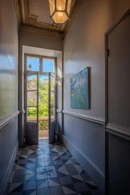 an empty hallway with a window and a tile floor at Le Lac Studio Moderne Proche Suquet - climatisation Wifi - LIMESTAY in Cannes
