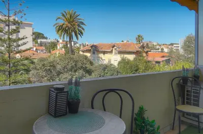 a table and chairs on a balcony with a view at Isa - Clim - WiFi - Balcon - VCA in Le Cannet