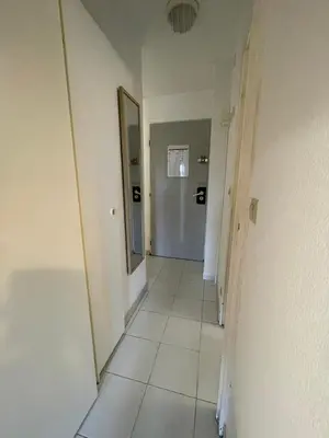a hallway with a mirror and a hallway sidx sidx sidx at Appartement Cannes, Piscine - Terrasse, Jardin Privatif - 4 Personnes in Cannes