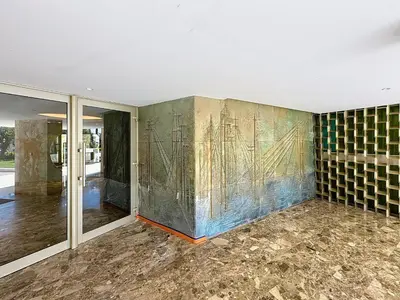 an empty room with a mural on the wall at Beachfront 2-bedroom apartment with balcony in Cannes