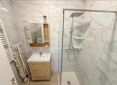 a bathroom with a shower and a sink at Studio Moderne Cannes - Parking - Proche de la plage in Cannes