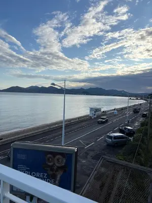 a view of a highway next to a body of water at Studio Moderne Cannes - Parking - Proche de la plage in Cannes